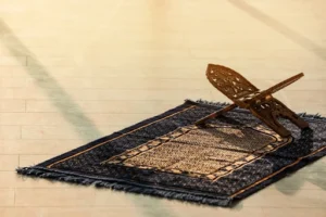 A wooden chair on a rug in a peaceful setting, reflecting tranquility and a prayer for healing.
